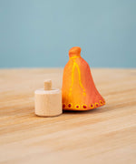 Bumbu Festive Bell Celebration decorative Figure to fit on a Grimm's celebration ring. The figure is shown with the bell seperate from the base. These festive figures are perfect for your Christmas celebration ring set up. These expertly hand crafted items are part of a large range of wooden toys available here at Babipur. 