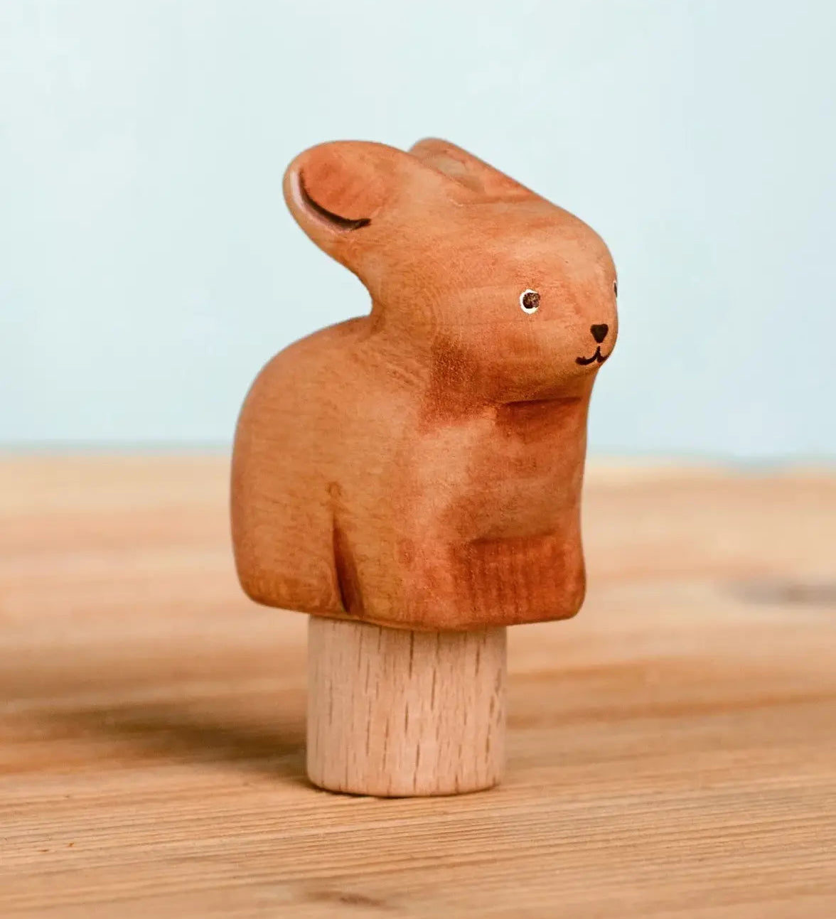 Bumbu handcrafted wooden brown festive bunny figure standing on wooden base for Grimms celebration ring