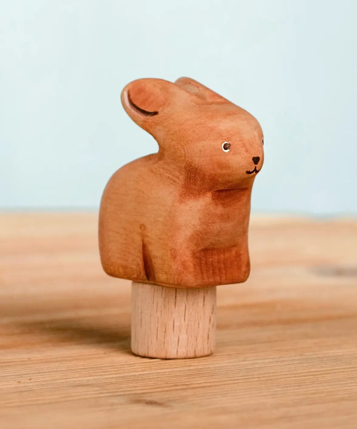 Bumbu handcrafted wooden brown festive bunny figure standing on wooden base for Grimms celebration ring