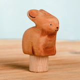 Bumbu handcrafted wooden brown festive bunny figure standing on wooden base for Grimms celebration ring