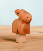 Bumbu handcrafted wooden brown festive bunny figure standing on wooden base for Grimms celebration ring