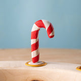 Bumbu red and white Festive Candy Cane Celebration ring decorative Figure to fit on a Grimm's celebration ring. These festive figures are perfect for your Christmas celebration ring set up. These expertly hand crafted items are part of a large range of wooden toys available here at Babipur. 