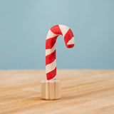 Bumbu red and white Festive Candy Cane Celebration ring decorative Figure to fit on a Grimm's celebration ring. These festive figures are perfect for your Christmas celebration ring set up. These expertly hand crafted items are part of a large range of wooden toys available here at Babipur. 