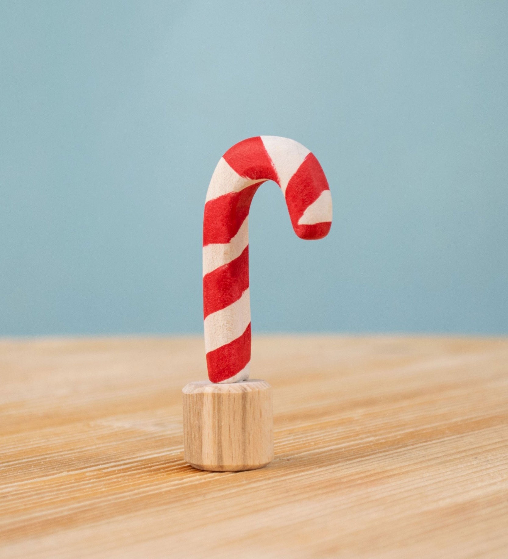 Bumbu red and white Festive Candy Cane Celebration ring decorative Figure to fit on a Grimm's celebration ring. These festive figures are perfect for your Christmas celebration ring set up. These expertly hand crafted items are part of a large range of wooden toys available here at Babipur. 