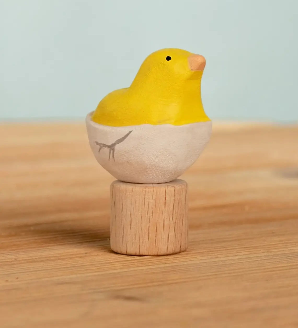 Bumbu handcrafted wooden yellow festive chick in egg figure standing on wooden base for Grimms celebration ring