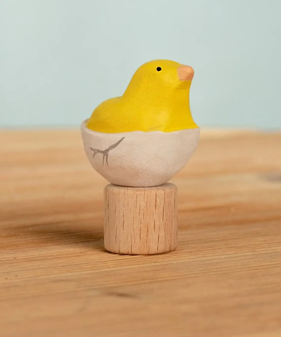 Bumbu handcrafted wooden yellow festive chick in egg figure standing on wooden base for Grimms celebration ring