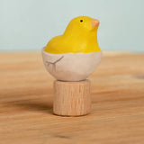 Bumbu handcrafted wooden yellow festive chick in egg figure standing on wooden base for Grimms celebration ring