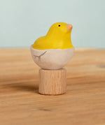 Bumbu handcrafted wooden yellow festive chick in egg figure standing on wooden base for Grimms celebration ring