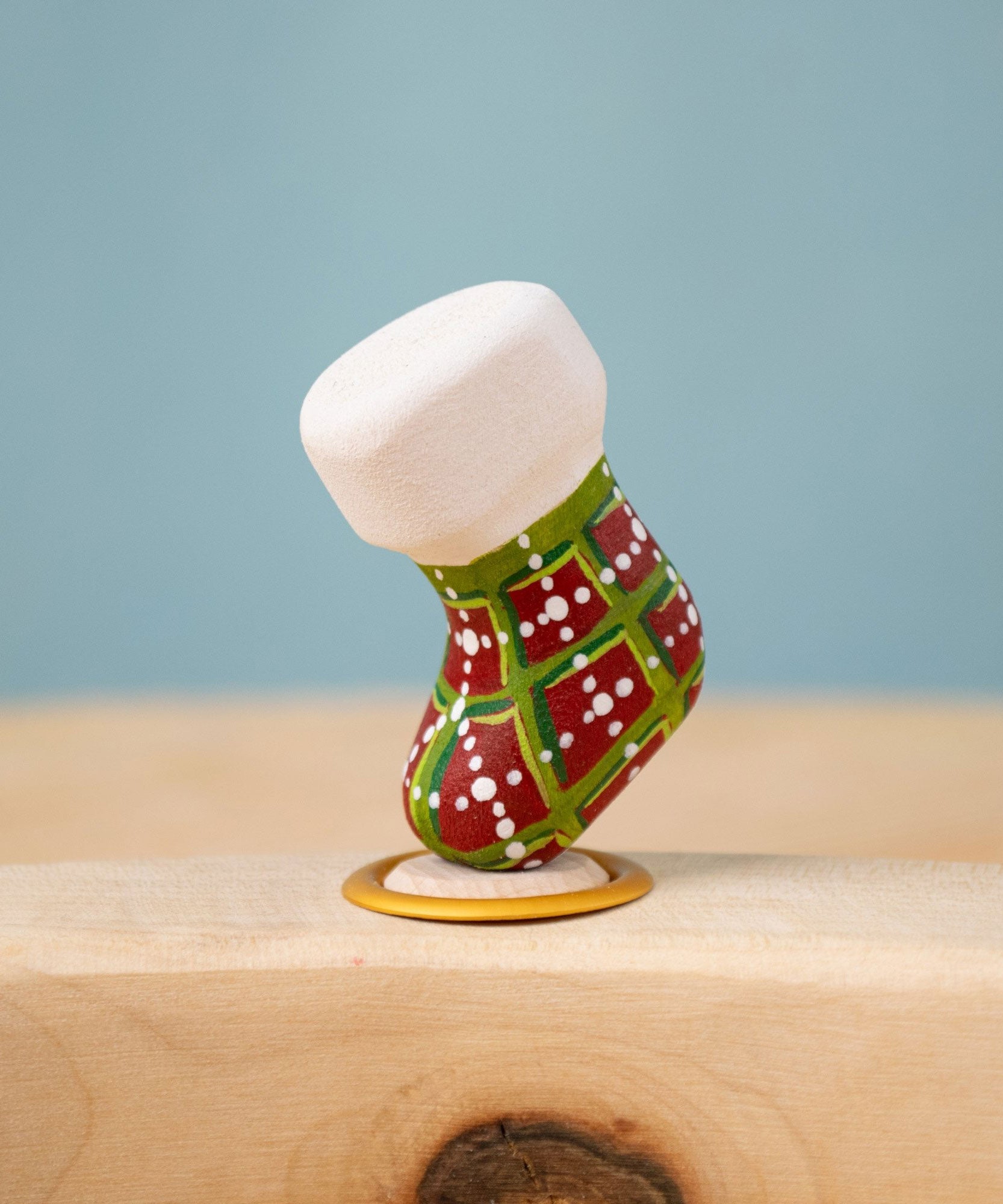 Bumbu red and green Festive Christmas Stocking Celebration decorative Figure to fit on a Grimm's celebration ring. These festive figures are perfect for your Christmas celebration ring set up. These expertly hand crafted items are part of a large range of wooden toys available here at Babipur. 