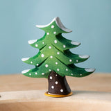 Bumbu Festive Tree Celebration decorative Figure to fit on a Grimm's celebration ring. The figure is a green fir tree decorated with snow.  These festive figures are perfect for your Christmas celebration ring set up. These expertly hand crafted items are part of a large range of wooden toys available here at Babipur. 