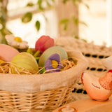 Straw basket with Bumbu handcrafted festive egg decorative figures filled with straw