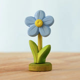 Bumbu handcrafted wooden blue festive forget me not figure standing on wooden green base 