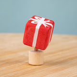 Bumbu red Festive Gift Celebration decorative Figure to fit on a Grimm's celebration ring. These festive figures are perfect for your Chritmas celebration ring set up. Bumbu red Festive Gift Celebration decorative Figure to fit on a Grimm's celebration ring. These festive figures are perfect for your Christmas celebration ring set up. These expertly hand crafted items are part of a large range of wooden toys available here at Babipur. 