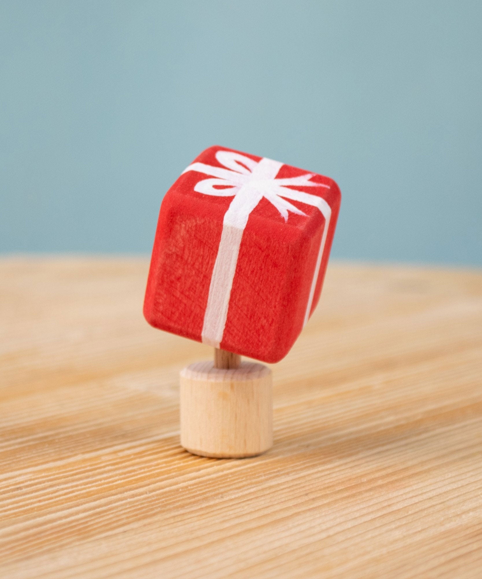 Bumbu red Festive Gift Celebration decorative Figure to fit on a Grimm's celebration ring. These festive figures are perfect for your Chritmas celebration ring set up. Bumbu red Festive Gift Celebration decorative Figure to fit on a Grimm's celebration ring. These festive figures are perfect for your Christmas celebration ring set up. These expertly hand crafted items are part of a large range of wooden toys available here at Babipur. 