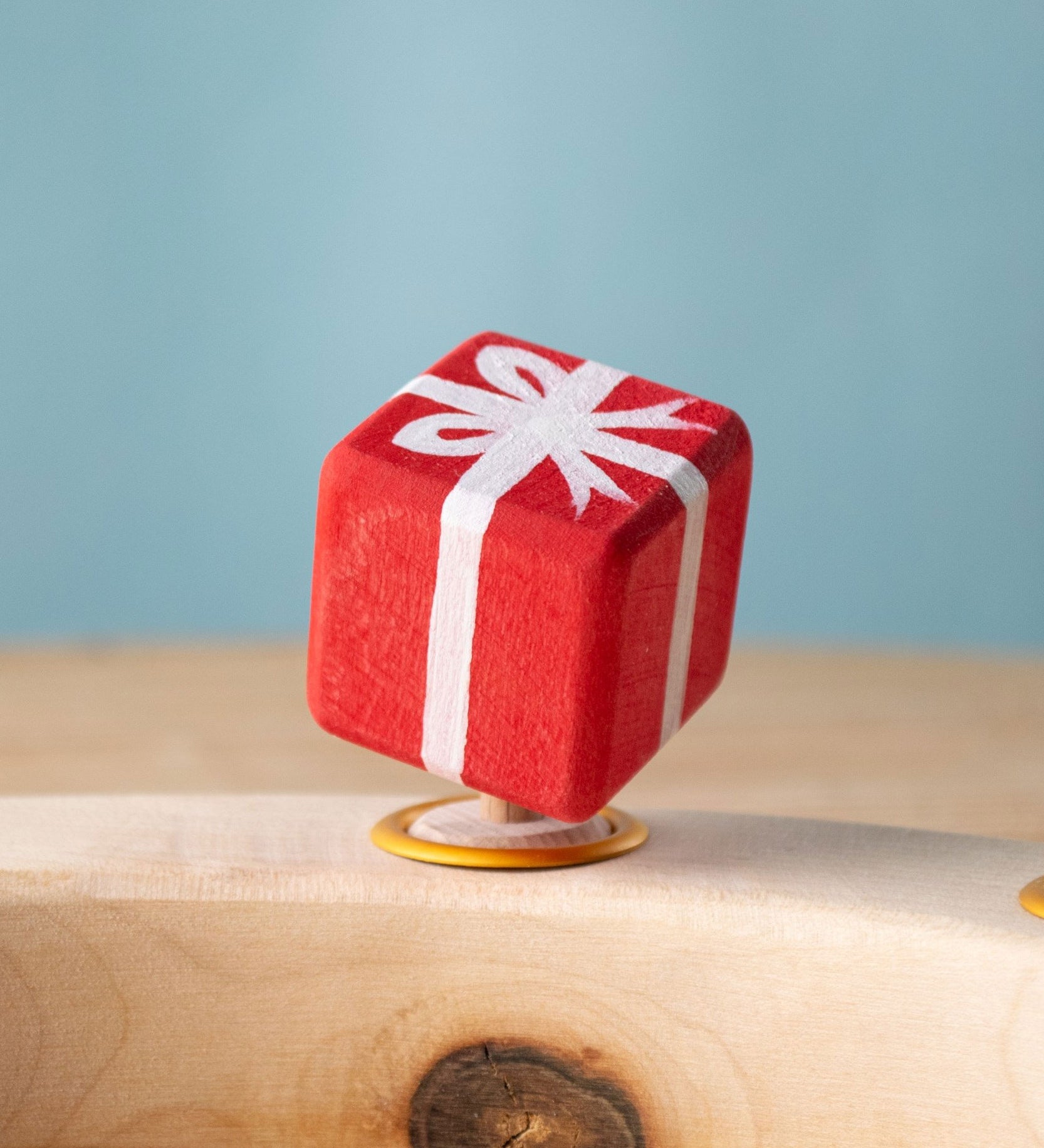 Bumbu red Festive Gift Celebration decorative Figure to fit on a Grimm's celebration ring shown on a celebration ring. These festive figures are perfect for your Chritmas celebration ring set up. Bumbu red Festive Gift Celebration decorative Figure to fit on a Grimm's celebration ring. These festive figures are perfect for your Christmas celebration ring set up. These expertly hand crafted items are part of a large range of wooden toys available here at Babipur. 