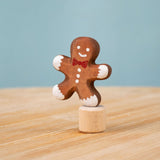 Bumbu Festive Gingerbread man Celebration decorative Figure to fit on a Grimm's celebration ring. These festive figures are perfect for your Christmas celebration ring set up. These expertly hand crafted items are part of a large range of wooden toys available here at Babipur. 