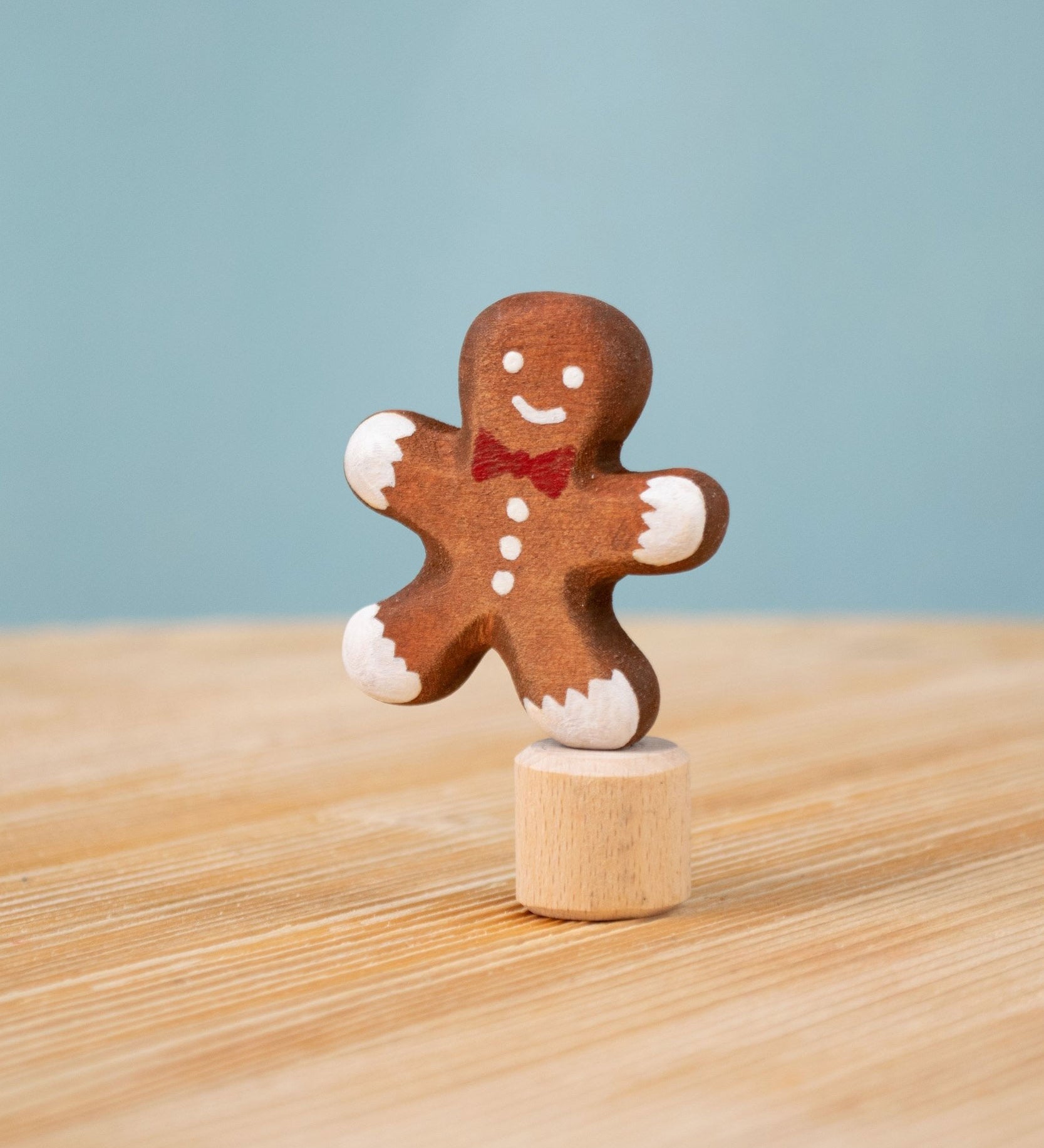Bumbu Festive Gingerbread man Celebration decorative Figure to fit on a Grimm's celebration ring. These festive figures are perfect for your Christmas celebration ring set up. These expertly hand crafted items are part of a large range of wooden toys available here at Babipur. 