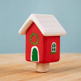 Bumbu red Festive house Celebration decorative Figure to fit on a Grimm's celebration ring. These festive figures are perfect for your Christmas celebration ring set up. These expertly hand crafted items are part of a large range of wooden toys available here at Babipur. 