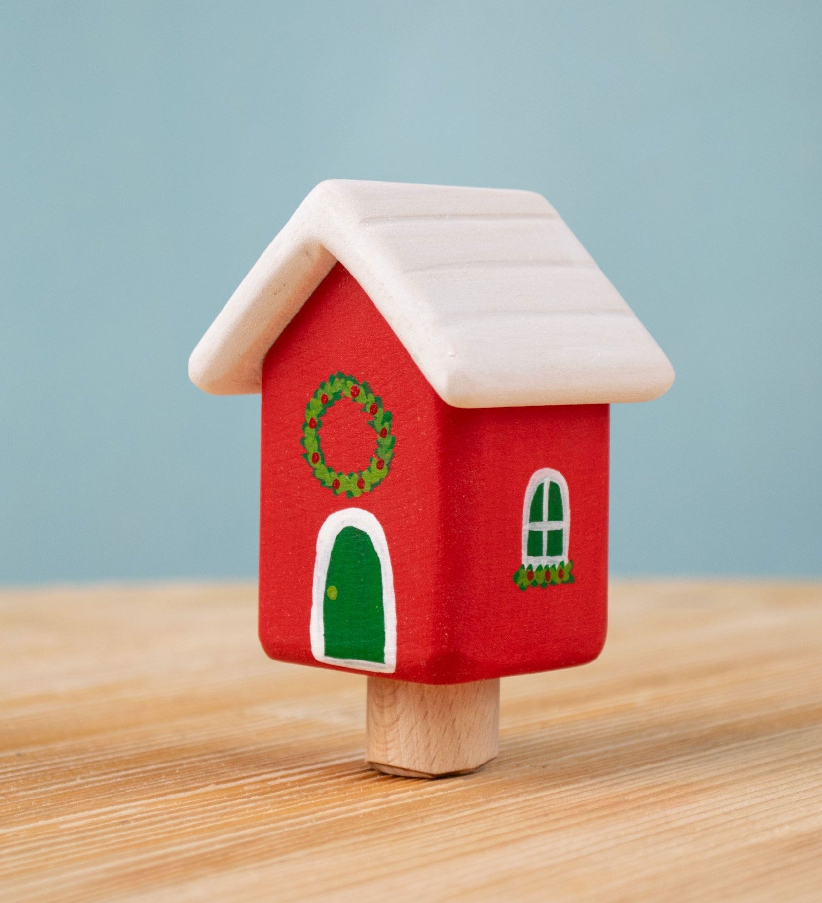 Bumbu red Festive house Celebration decorative Figure to fit on a Grimm's celebration ring. These festive figures are perfect for your Christmas celebration ring set up. These expertly hand crafted items are part of a large range of wooden toys available here at Babipur. 