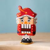 Bumbu red Festive Nutcracker Celebration decorative Figure to fit on a Grimm's celebration ring. These festive figures are perfect for your Christmas celebration ring set up. These expertly hand crafted items are part of a large range of wooden toys available here at Babipur. 