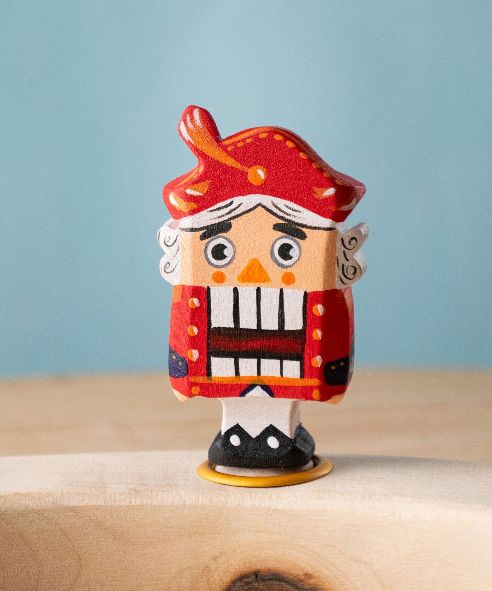 Bumbu red Festive Nutcracker Celebration decorative Figure to fit on a Grimm's celebration ring. These festive figures are perfect for your Christmas celebration ring set up. These expertly hand crafted items are part of a large range of wooden toys available here at Babipur. 