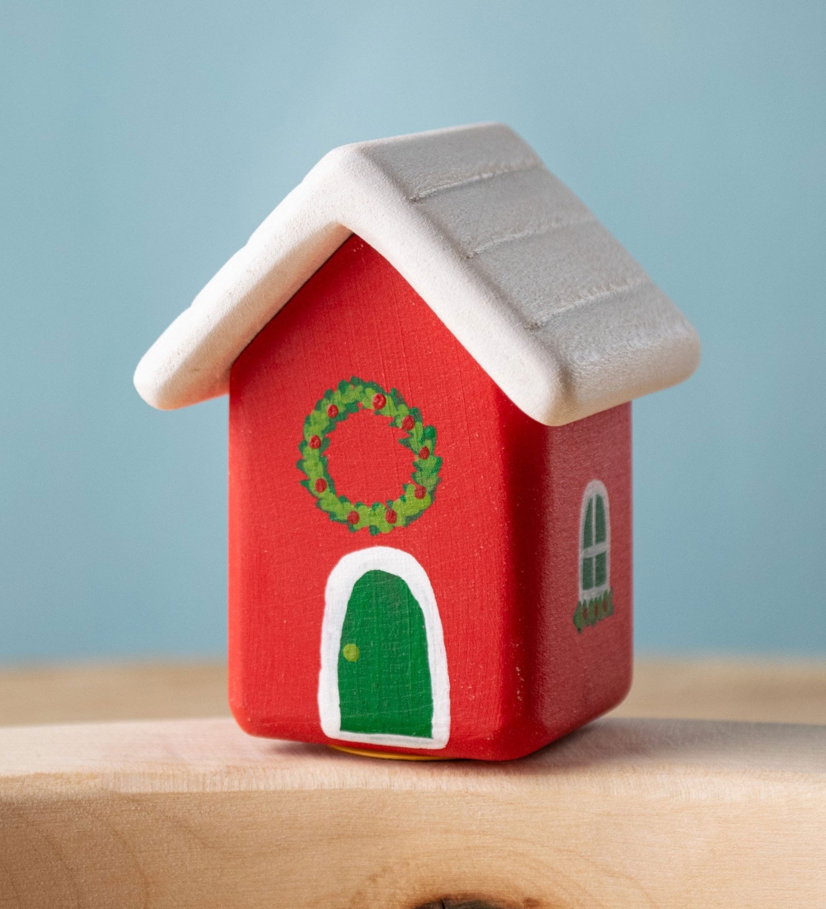 Bumbu red Festive house Celebration decorative Figure to fit on a Grimm's celebration ring. These festive figures are perfect for your Christmas celebration ring set up. These expertly hand crafted items are part of a large range of wooden toys available here at Babipur. 