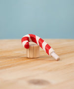 Bumbu red and white Festive Candy Cane Celebration ring decorative Figure to fit on a Grimm's celebration ring. These festive figures are perfect for your Christmas celebration ring set up. These expertly hand crafted items are part of a large range of wooden toys available here at Babipur. 
