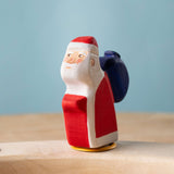 Bumbu red Festive Santa Celebration decorative Figure to fit on a Grimm's celebration ring. These festive figures are perfect for your Christmas celebration ring set up. These expertly hand crafted items are part of a large range of wooden toys available here at Babipur. 