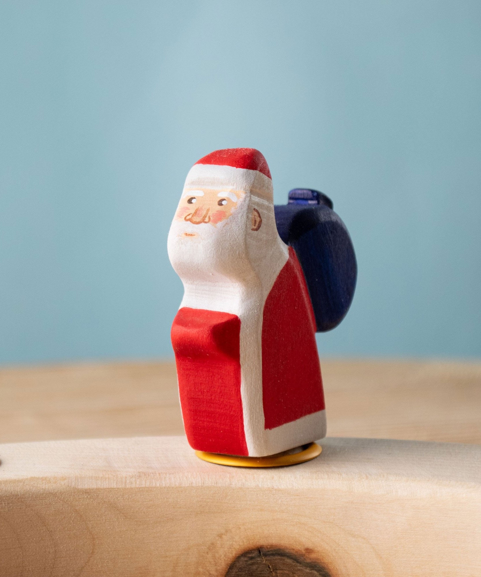 Bumbu red Festive Santa Celebration decorative Figure to fit on a Grimm's celebration ring. These festive figures are perfect for your Christmas celebration ring set up. These expertly hand crafted items are part of a large range of wooden toys available here at Babipur. 