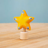 Bumbu yellow Festive Star Celebration decorative Figure to fit on a Grimm's celebration ring. These festive figures are perfect for your Christmas celebration ring set up. These expertly hand crafted items are part of a large range of wooden toys available here at Babipur. 