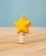 Bumbu yellow Festive Star Celebration decorative Figure to fit on a Grimm's celebration ring. These festive figures are perfect for your Christmas celebration ring set up. These expertly hand crafted items are part of a large range of wooden toys available here at Babipur. 