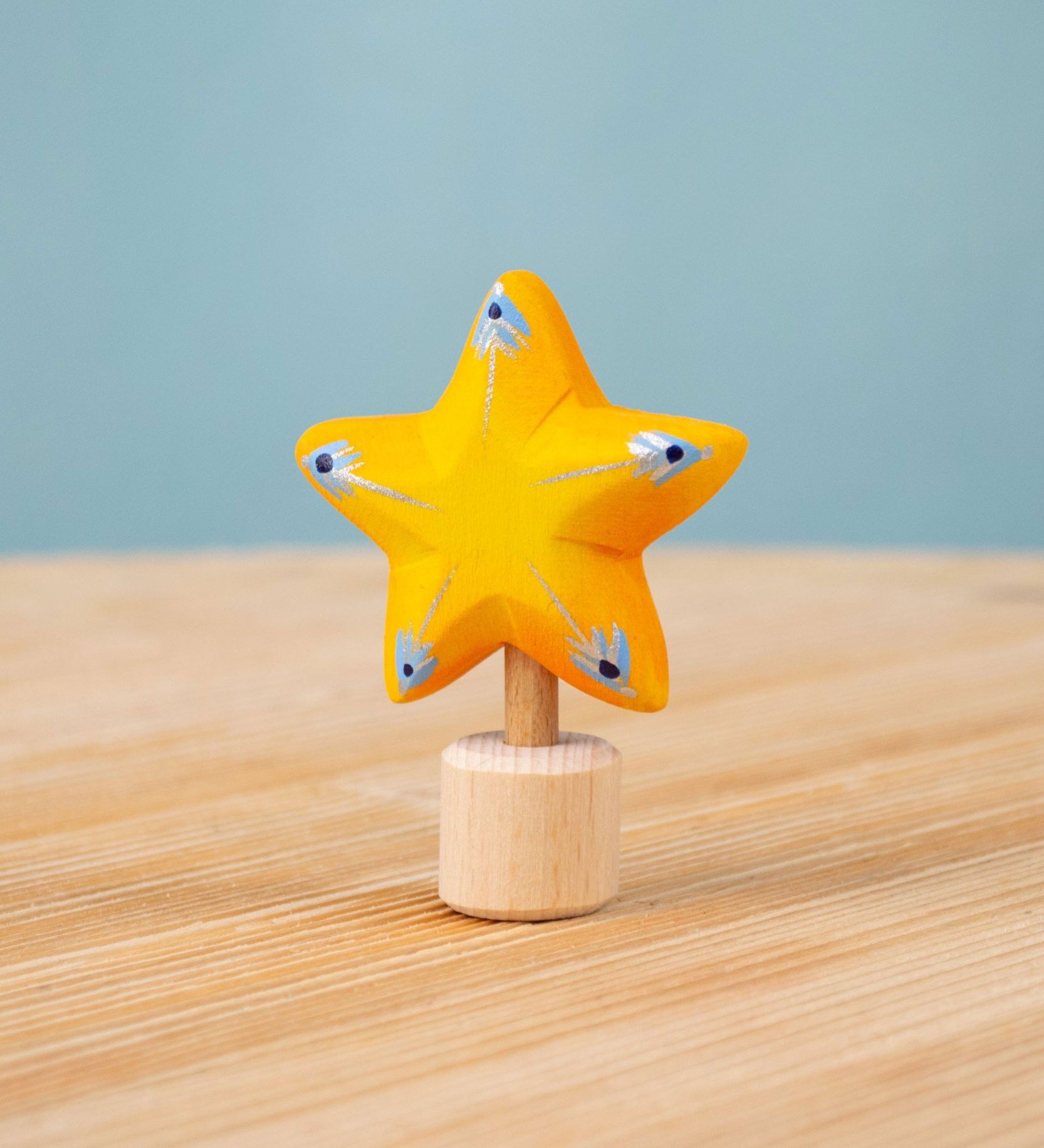 Bumbu yellow Festive Star Celebration decorative Figure to fit on a Grimm's celebration ring. These festive figures are perfect for your Christmas celebration ring set up. These expertly hand crafted items are part of a large range of wooden toys available here at Babipur. 