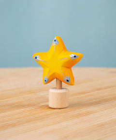 Bumbu yellow Festive Star Celebration decorative Figure to fit on a Grimm's celebration ring. These festive figures are perfect for your Christmas celebration ring set up. These expertly hand crafted items are part of a large range of wooden toys available here at Babipur. 