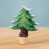 Bumbu Festive Tree Celebration decorative Figure to fit on a Grimm's celebration ring. The figure is a green fir tree decorated with snow. These festive figures are perfect for your Christmas celebration ring set up. These expertly hand crafted items are part of a large range of wooden toys available here at Babipur. 