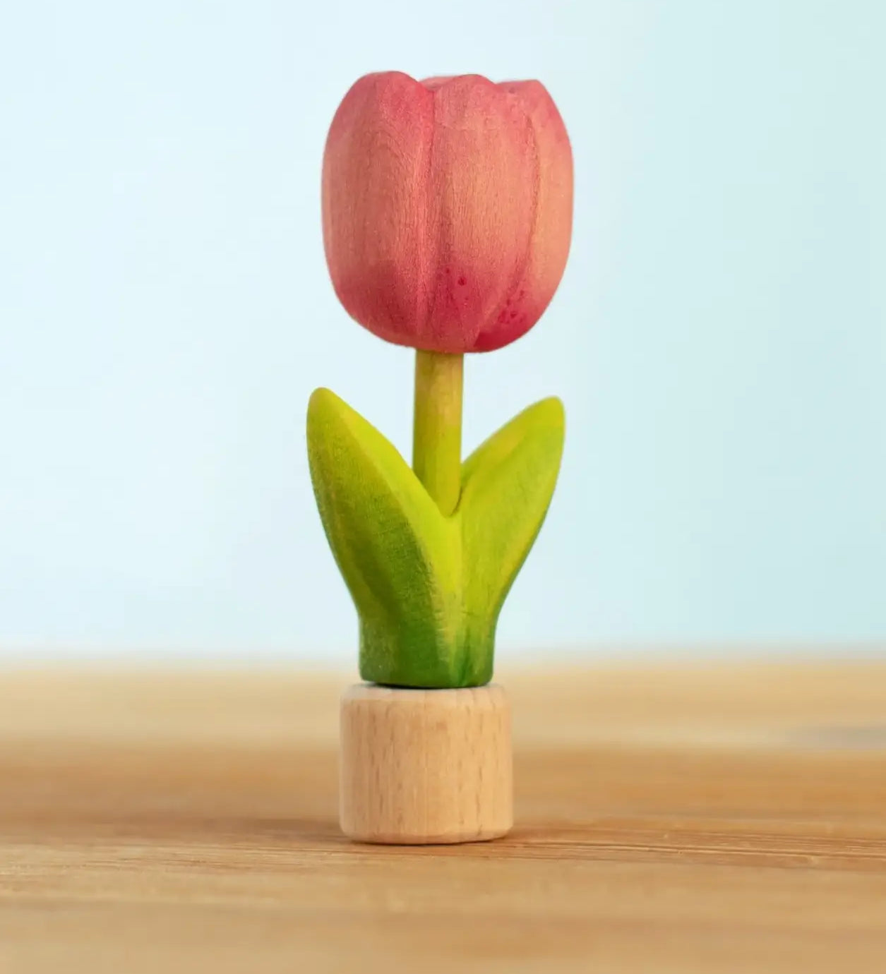 Bumbu handcrafted wooden pink festive tulip figure standing on wooden base for Grimms celebration ring