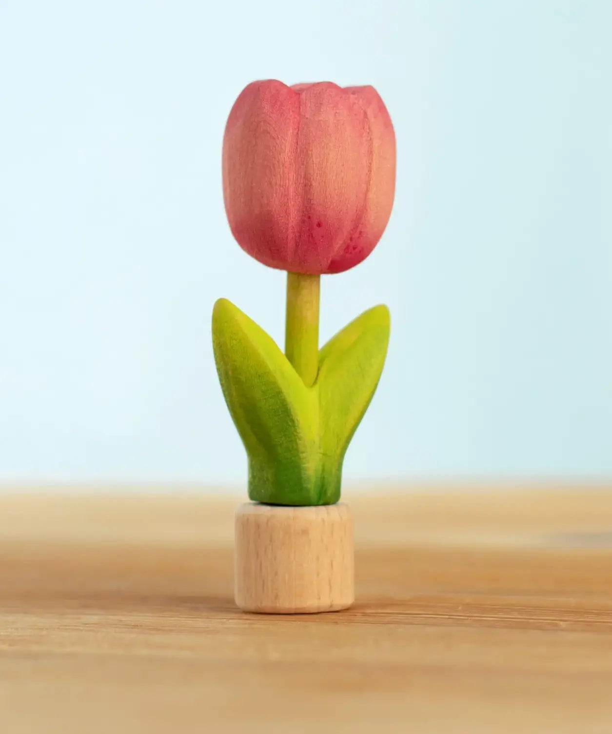 Bumbu handcrafted wooden pink festive tulip figure standing on wooden base for Grimms celebration ring