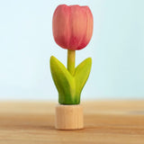 Bumbu handcrafted wooden pink festive tulip figure standing on wooden base for Grimms celebration ring