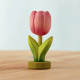 Bumbu handcrafted wooden pink festive tulip figure standing on wooden green base