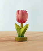 Bumbu handcrafted wooden pink festive tulip figure standing on wooden green base
