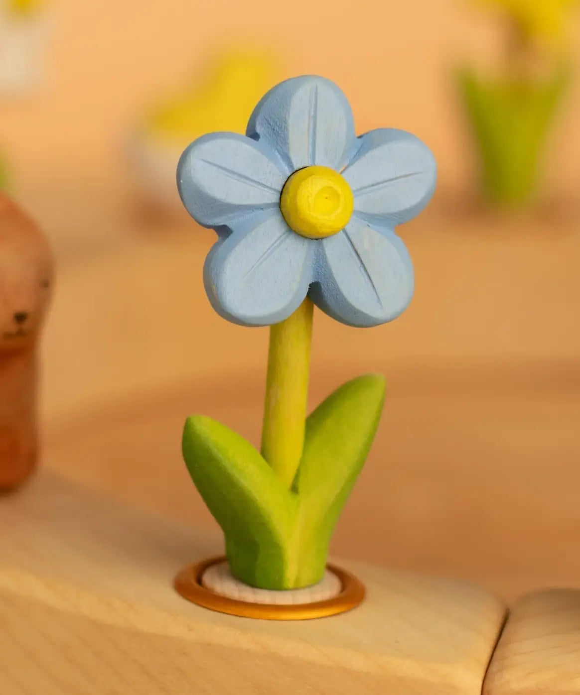 Bumbu wooden blue forget me not decorative figure standing in a celebration ring