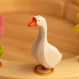 Bumbu wooden white goose decorative figure standing in a celebration ring