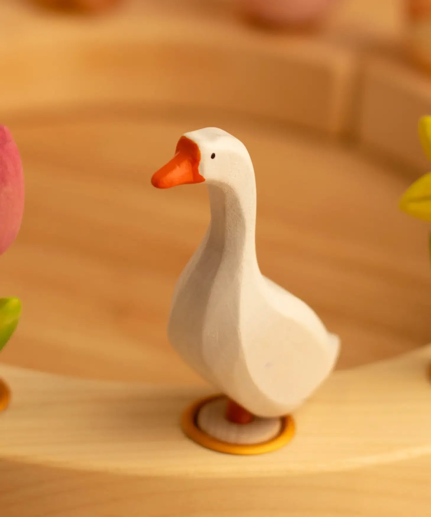 Bumbu wooden white goose decorative figure standing in a celebration ring