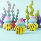 The Bumbu handmade wooden jellyfish toy figures, with Bumbu wooden seaweed and kelp toys in the background. 