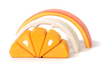 Segments of the Bumbu children's plastic free tangerine toy laid out on a white background