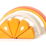 Segments of the Bumbu children's plastic free tangerine toy laid out on a white background
