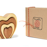 Bumbu sustainable wooden heart stacking toy on a white background next to its recyclable box