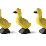 Close up of the Bumbu sustainable wooden duck chicks on a white background