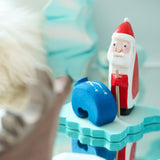 Close up of a Bumbu Santa Claus toy stood on a Bumbu ice floe block