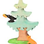 Bumbu raven and cheese toy in a wooden Bumbu tree on a white background
