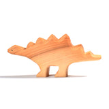 Side of the Bumbu plastic-free wooden stegosaurus dinosaur toy on a white background